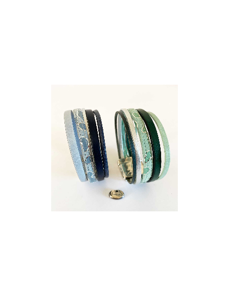 Bracelet cuir manchette de cuir melant des cuirs unis et cuir à motifs. Monté sur un fermoir magnétique. Tons bleus ou tons vert Bracelet cuir manchette de cuir melant des cuirs unis et cuir à motifs. Monté sur un fermoir magnétique. Tons bleus ou tons vert